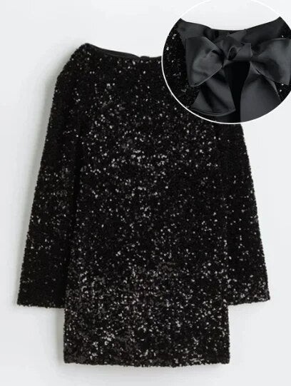 Long sleeve women's shimmering glitter midi dress, an elegant festive wear choice for any special occasion.