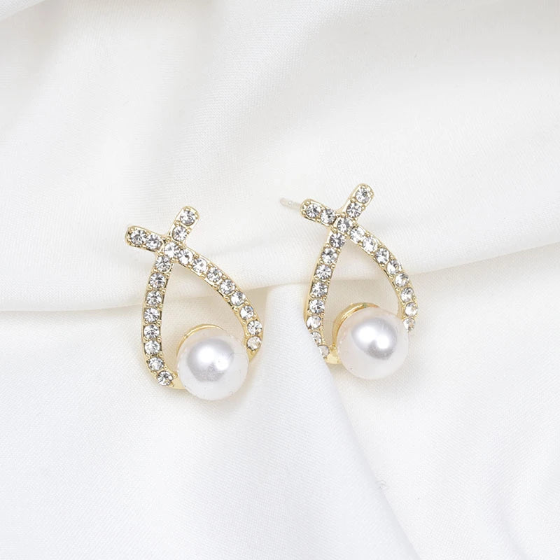 Close-up of elegant women's sparkling glitter & pearl drop earrings. Perfect accessory for glamour.