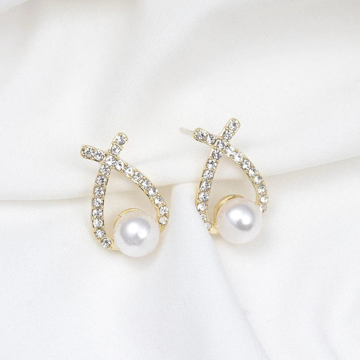 Close-up of elegant women's sparkling glitter & pearl drop earrings. Perfect accessory for glamour.