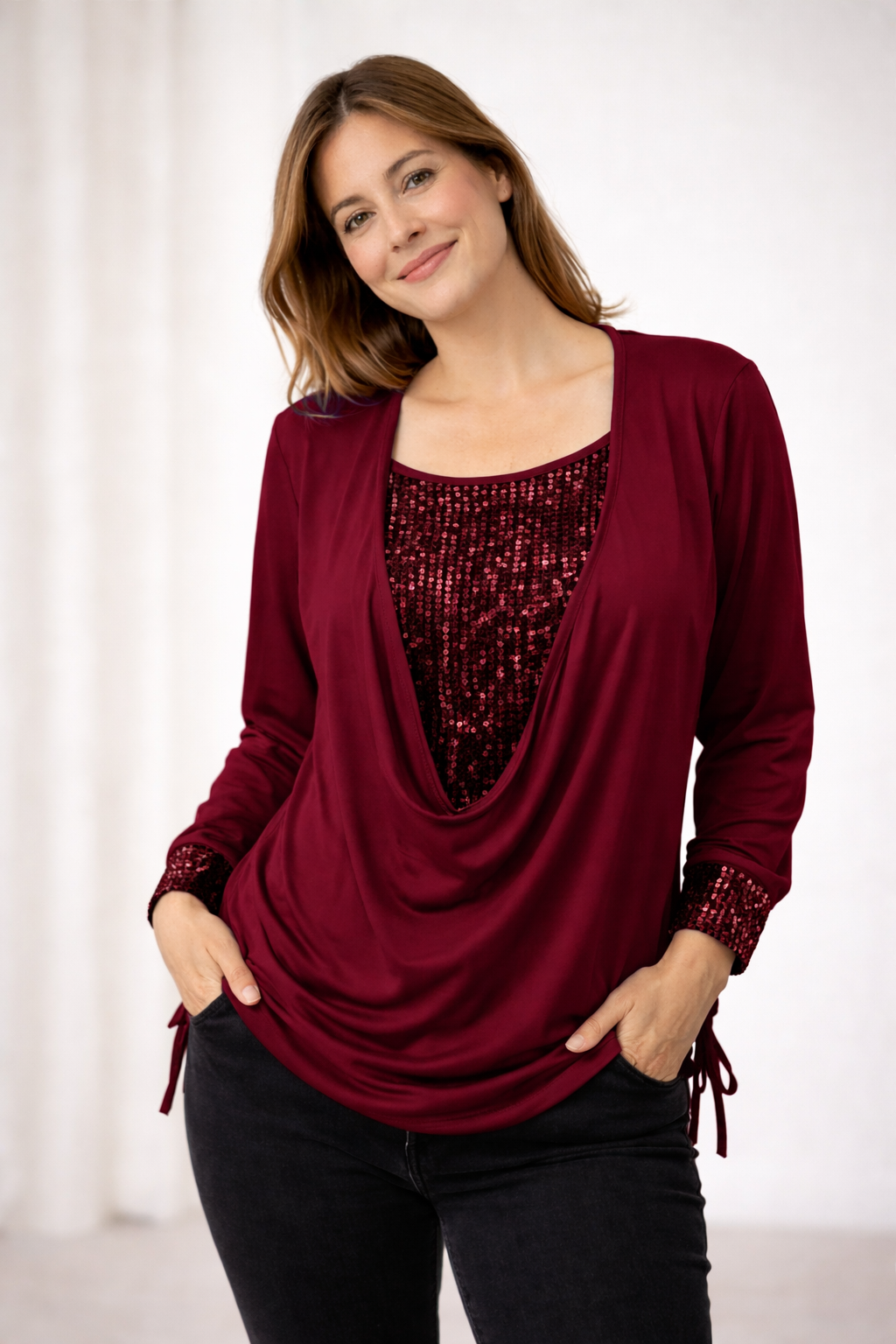 Close-up of the shimmering sequins on a women's glamorous party top, highlighting the sparkling texture.