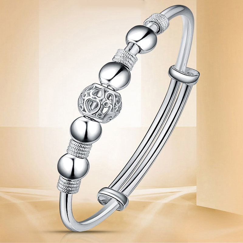 Elegant women's silver luck bead bracelet, perfect adjustable jewelry gift.