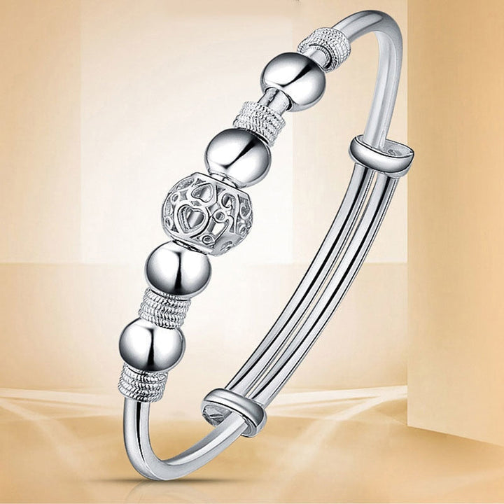 Elegant women's silver luck bead bracelet, perfect adjustable jewelry gift.