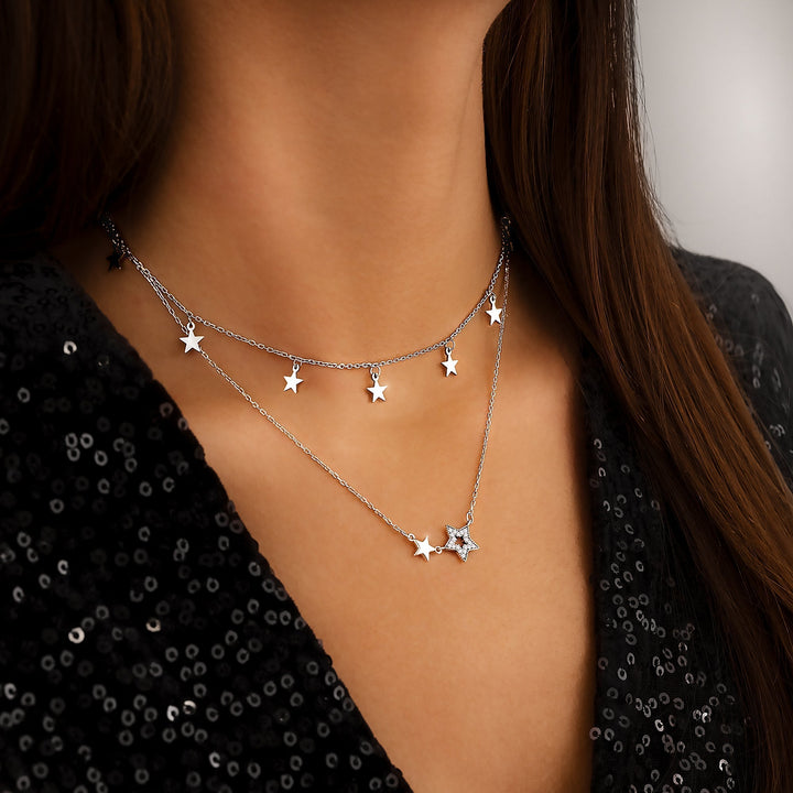 Stylish Elara women's star necklace, shimmering gold plated & silver, delicate celestial jewelry.