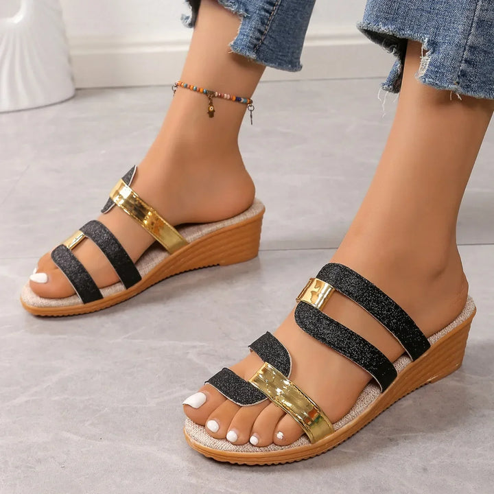 Elegant women's shimmering triple-strap sandals, ideal for dressy summer events.