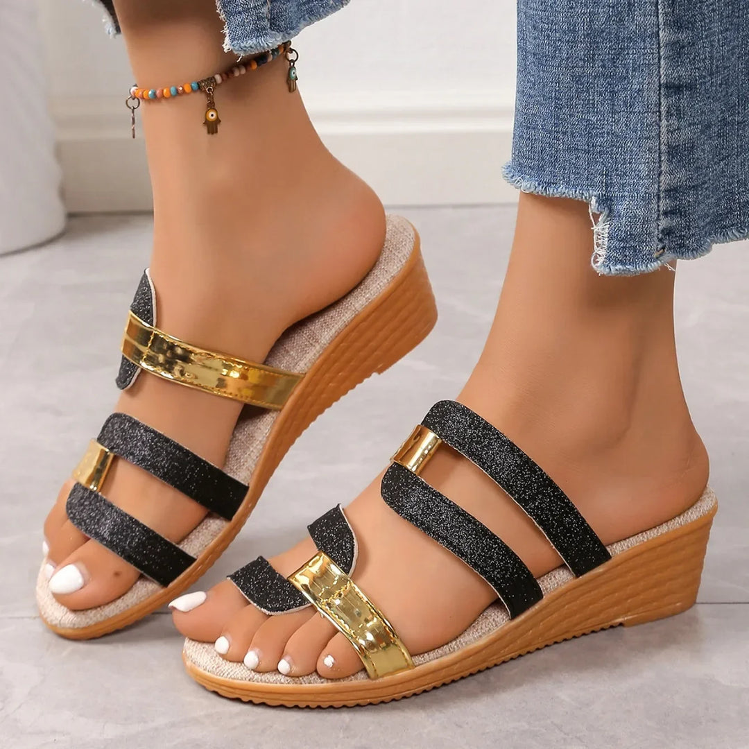 Full view of women's metallic triple-strap summer sandals with a comfortable sole.