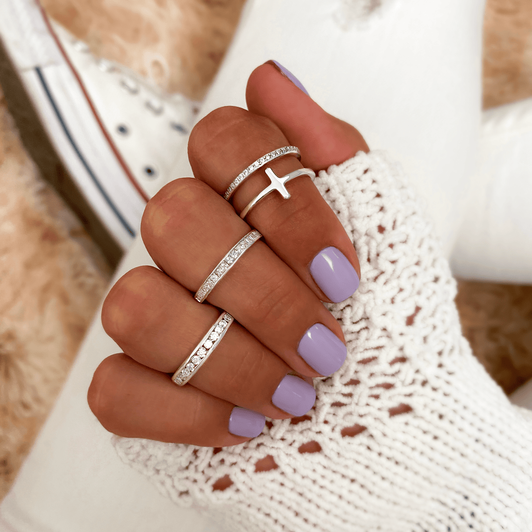 Stylish women's sterling silver ring with brilliant cubic zirconia stones.