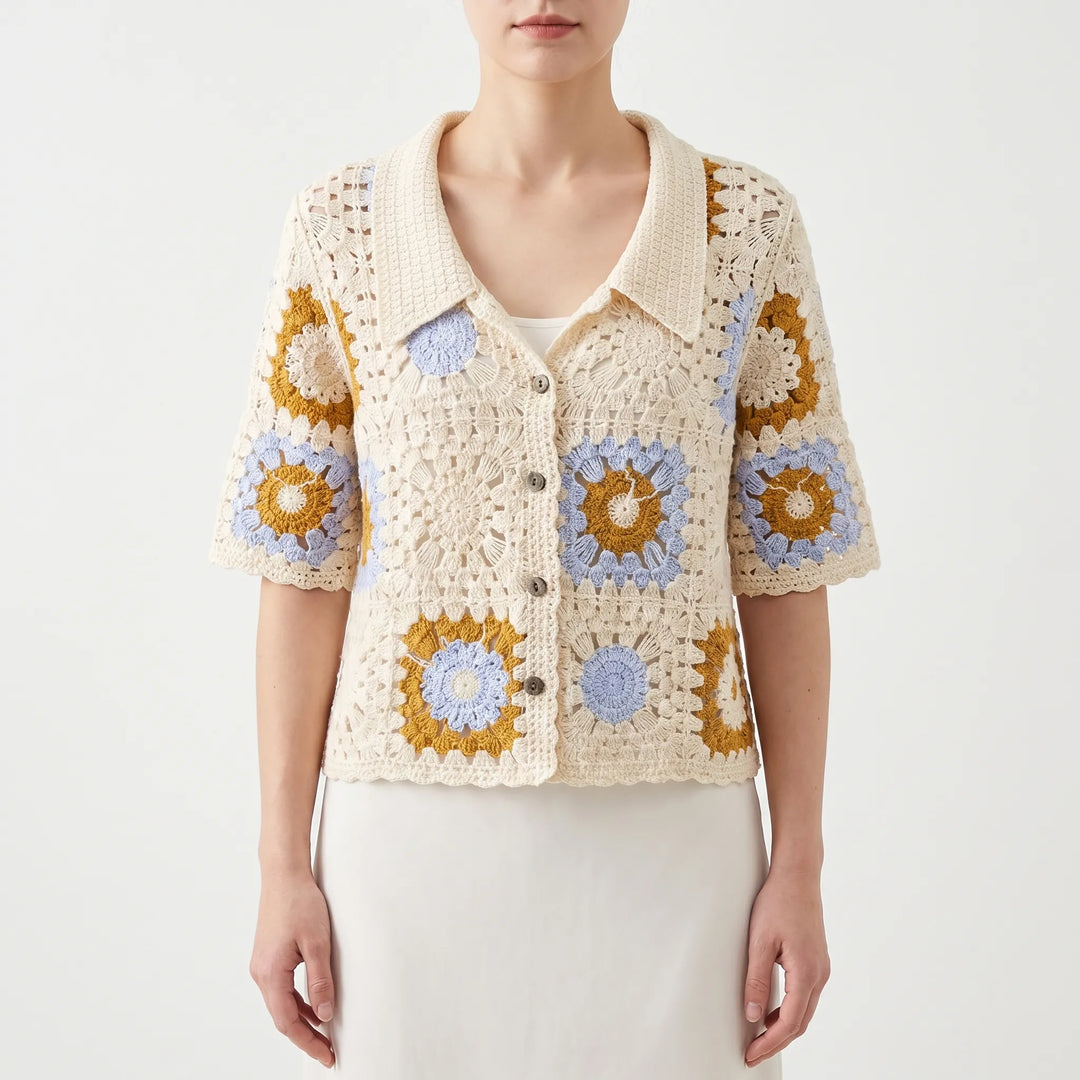 Vintage-style women's short-sleeve crochet cardigan with intricate geometric pattern. A versatile summer fashion top.