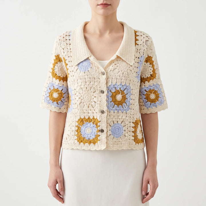 Vintage-style women's short-sleeve crochet cardigan with intricate geometric pattern. A versatile summer fashion top.