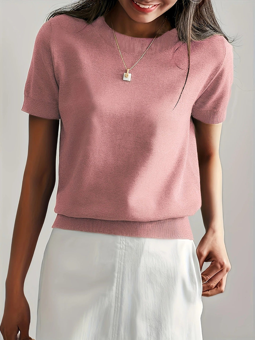 Women's knit tee with ribbed hem & short sleeves. Classic crew neck for spring/summer style.