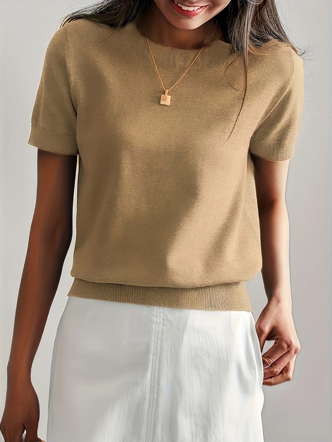 Knit women's crew neck tee, short sleeves, ribbed hem. An essential piece for versatile wardrobes.