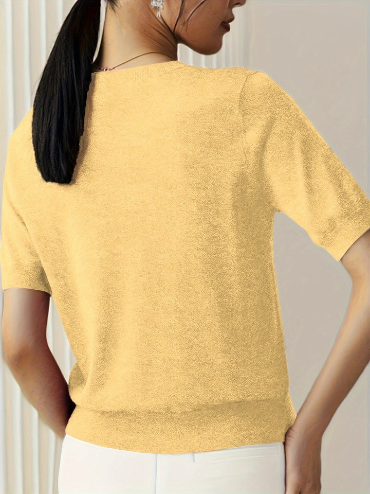Casual women's short sleeve crew neck tee, ribbed hem. A versatile knit top for summer fashion.