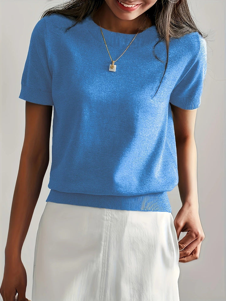 Chic women's short sleeve top, knit texture, crew neck, ribbed hem. Ideal for casual spring days.