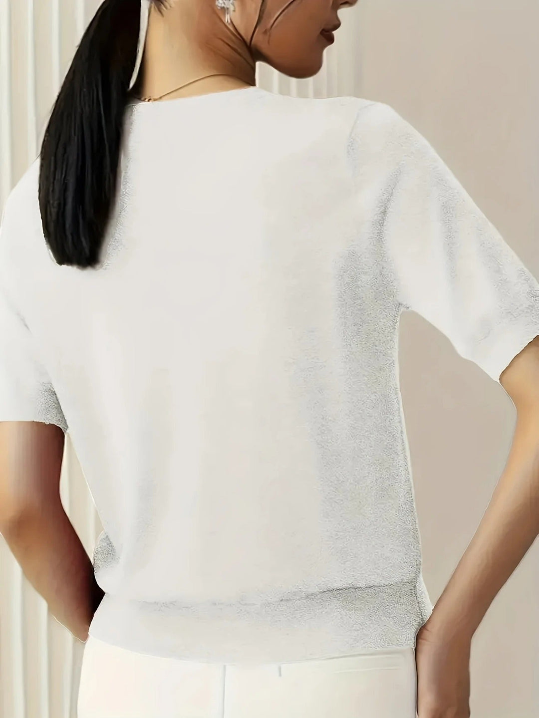 Women's casual knit tee, short sleeves, crew neck, ribbed hem. Perfect for spring/summer versatility.