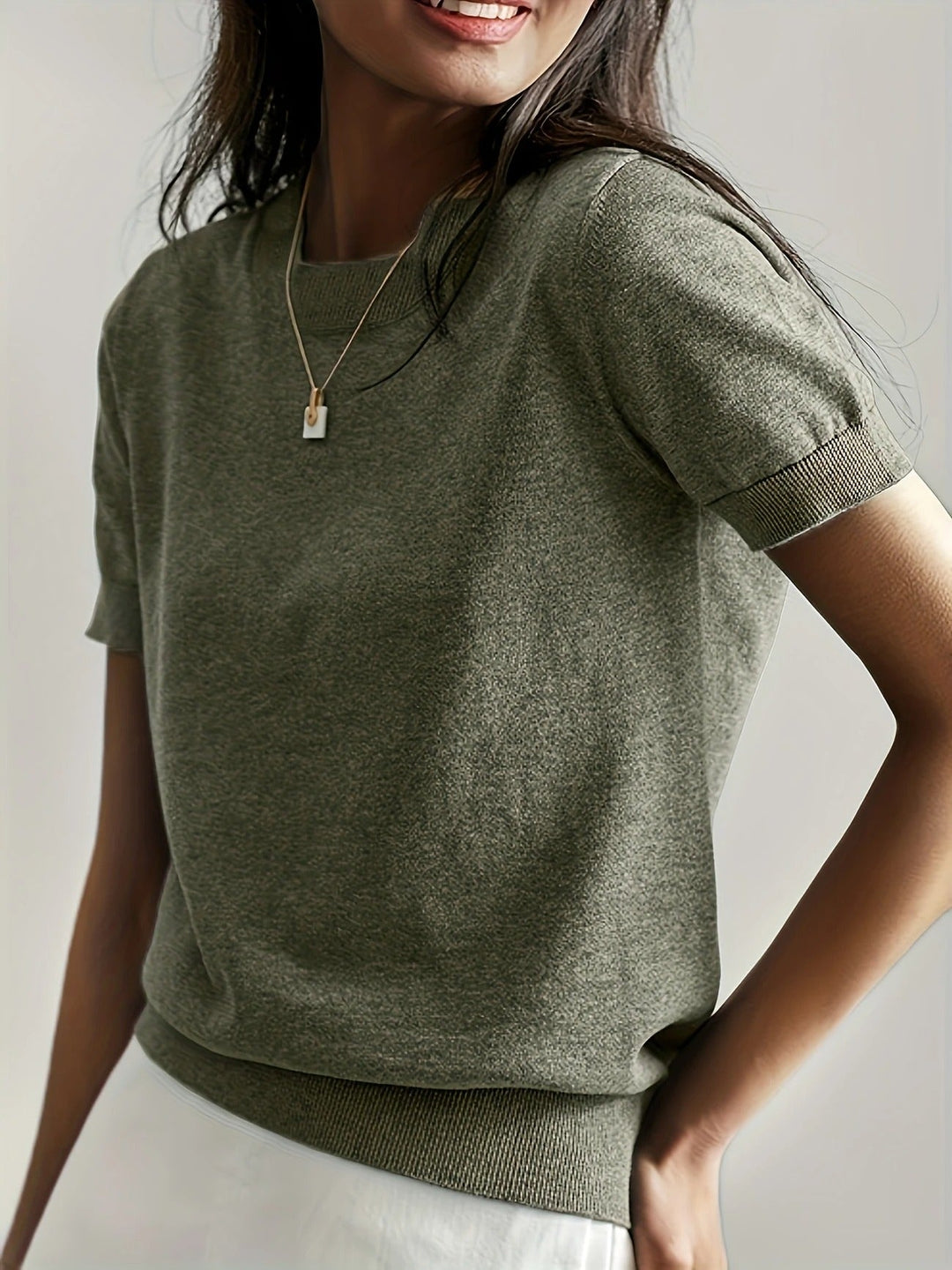Versatile women's short sleeve tee with classic crew neck and comfortable ribbed hem.
