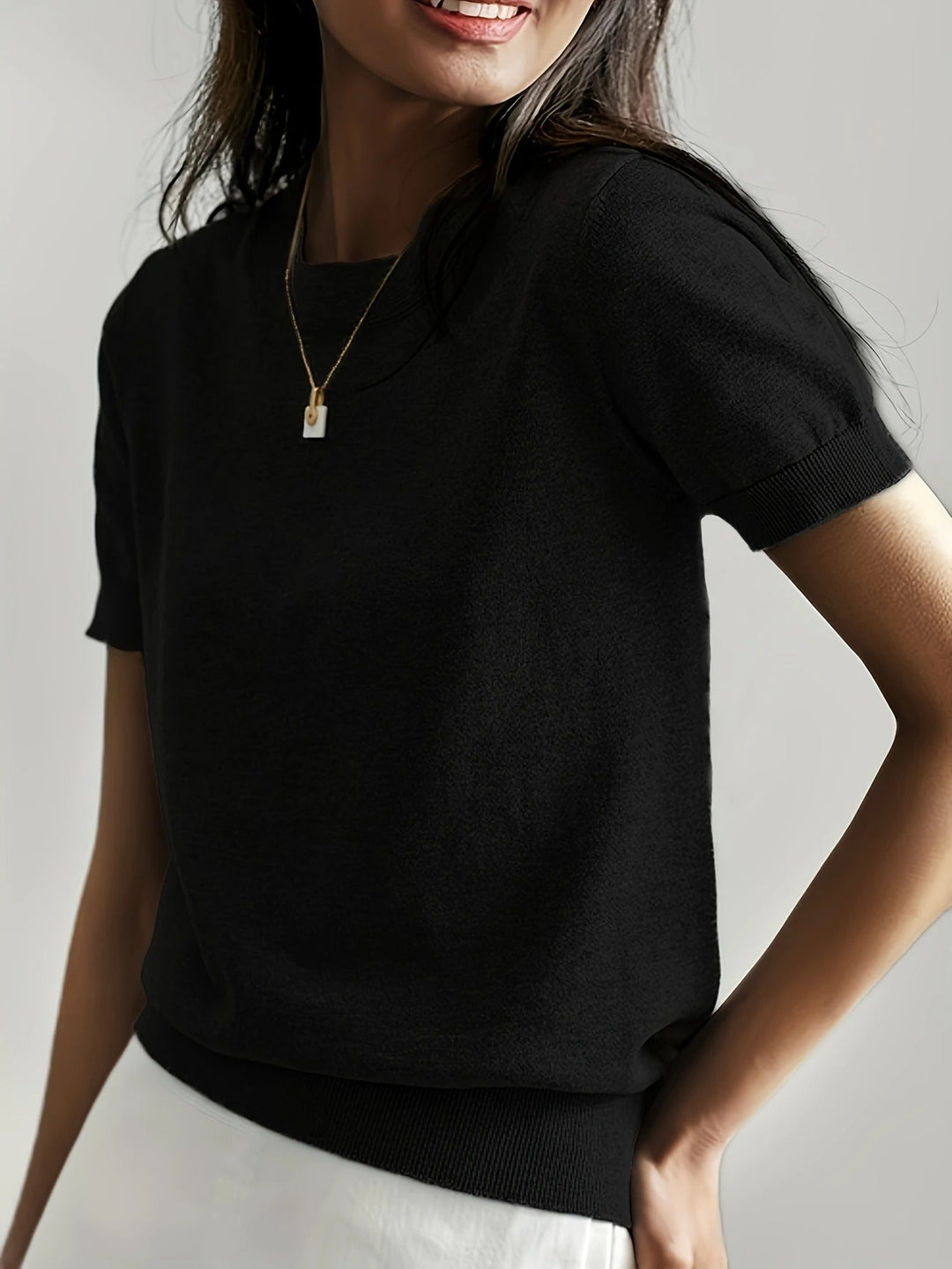 Women's spring/summer knit tee, short sleeve, crew neck, ribbed hem. Effortlessly chic.