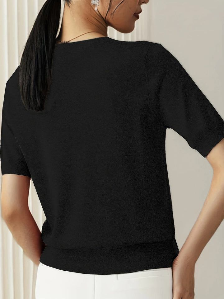 Women's everyday knit top featuring a crew neck, short sleeves, and ribbed hem detail.