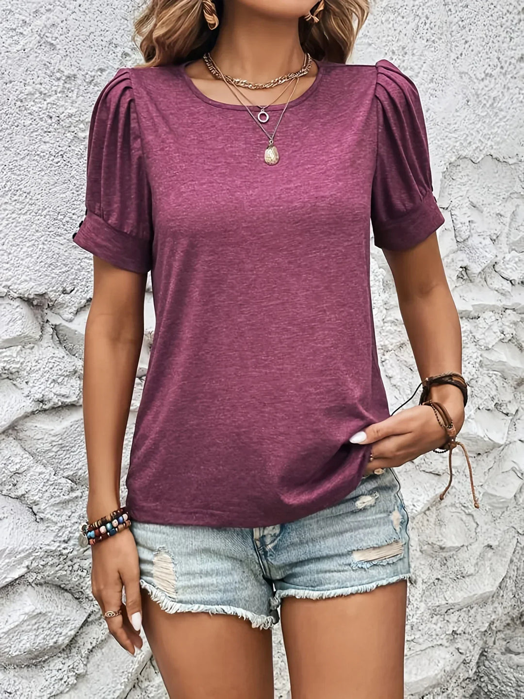 Elegant women's short sleeve top featuring ruffle detail. A chic, versatile piece for any trendy outfit.