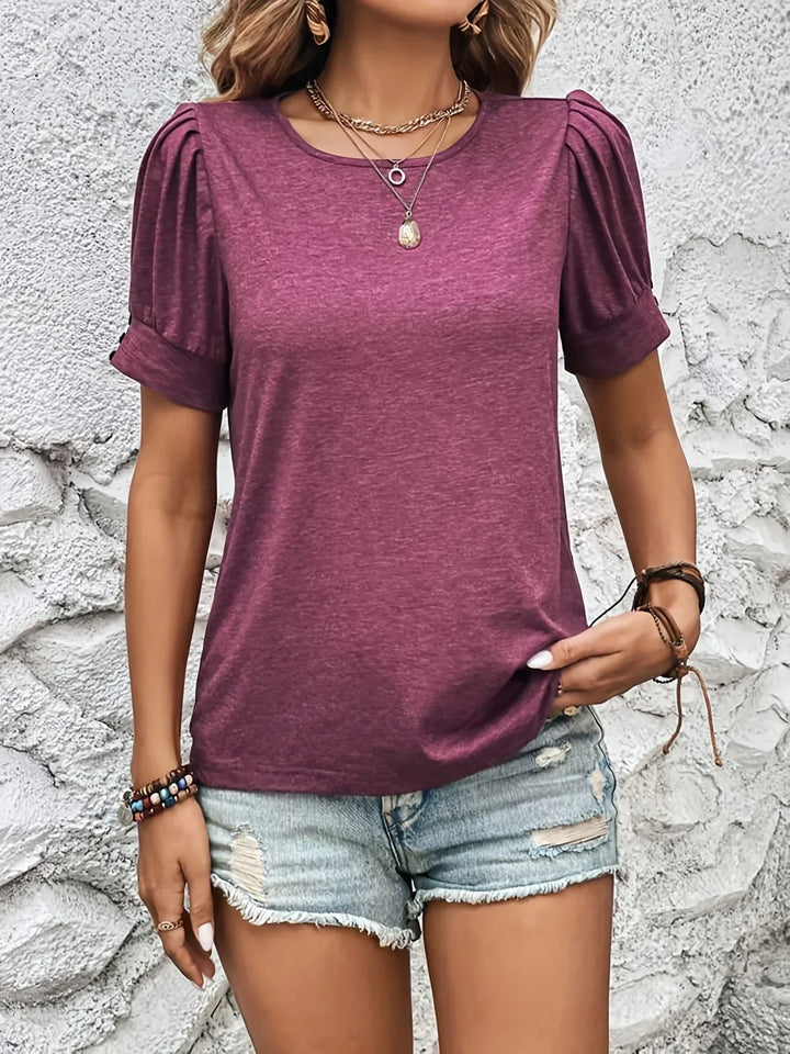 Elegant women's short sleeve top featuring ruffle detail. A chic, versatile piece for any trendy outfit.