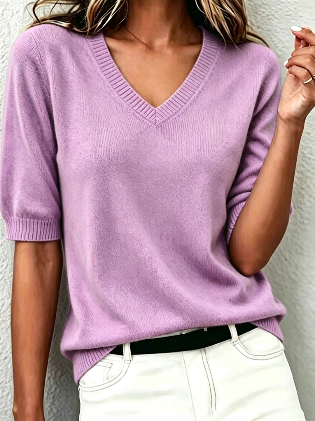 Women's short-sleeve V-neck sweater in soft knit for elegant, versatile everyday style.