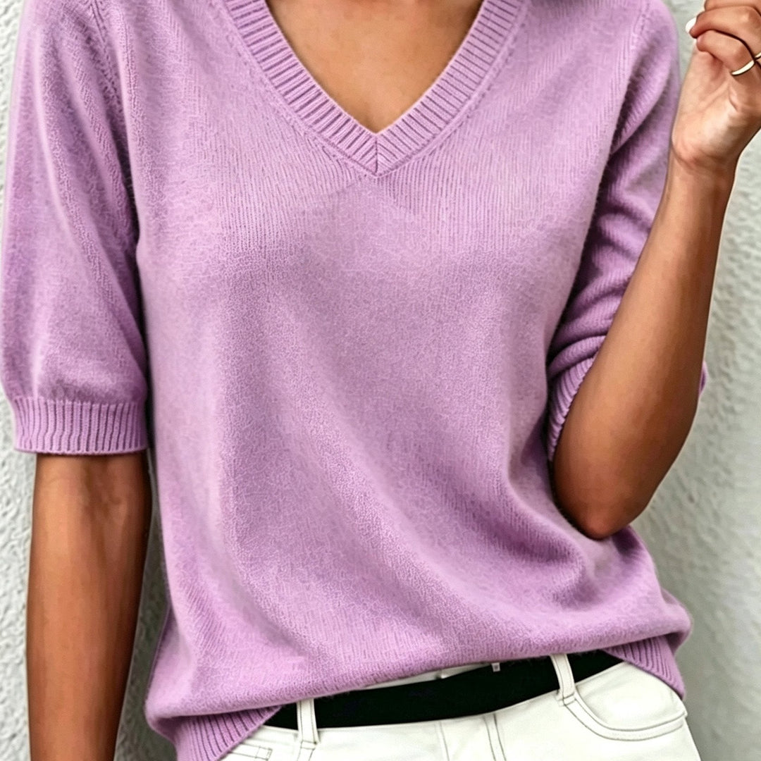 Soft knit women's short-sleeve V-neck sweater, comfortable and stylish for any occasion.