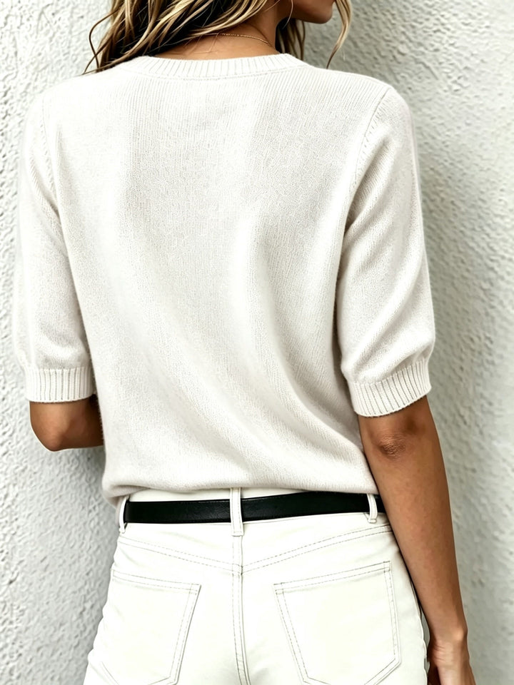 Women's short-sleeve V-neck sweater, a versatile piece of knitwear for effortless smart casual style.