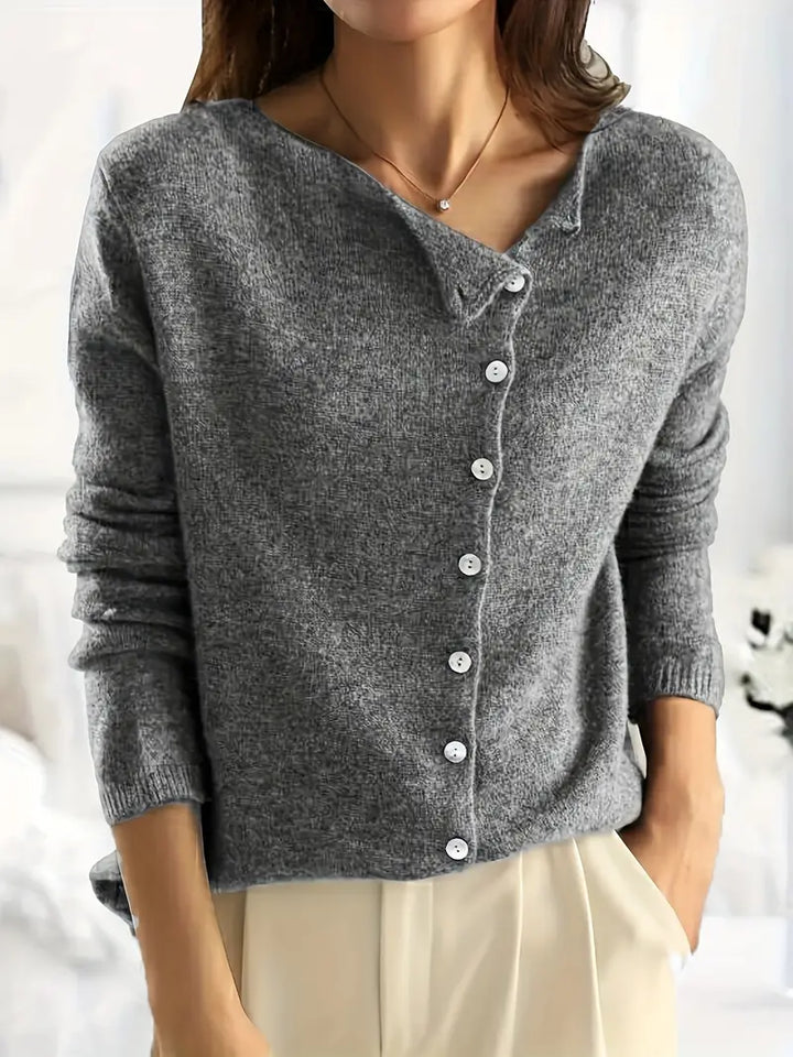 Modern women's Sienna asymmetrical button-front cardigan. Fashionable long sleeve layering piece, chic design.