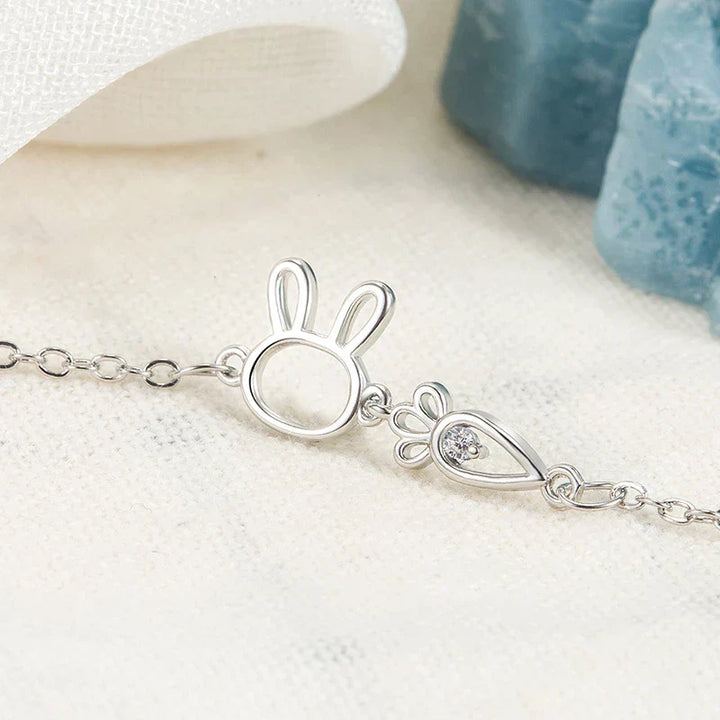 Adjustable silver bracelet featuring a delicate rabbit pendant. Perfect women's whimsical jewelry & gift.
