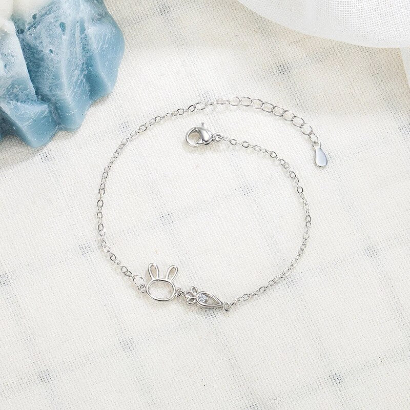 Delicate sterling silver bracelet with a whimsical rabbit pendant. Adjustable women's jewelry, charming design.