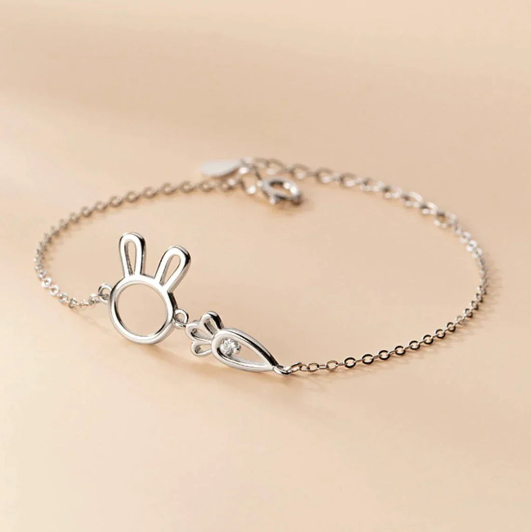 Elegant adjustable silver rabbit pendant bracelet, a delicate charm for women. Whimsical jewelry gift.