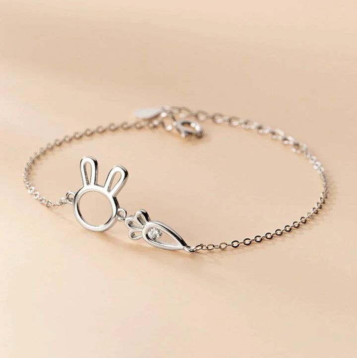 Elegant adjustable silver rabbit pendant bracelet, a delicate charm for women. Whimsical jewelry gift.
