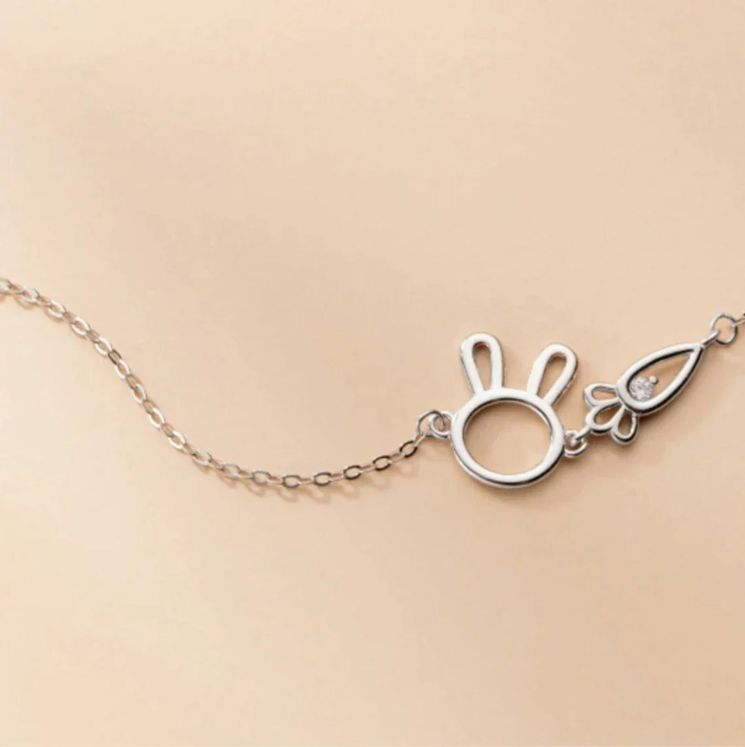 Whimsical women's adjustable silver bracelet with a charming rabbit pendant. Delicate jewelry for any occasion.