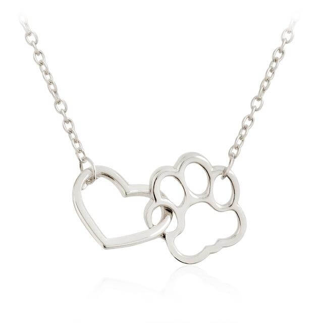 Elegant gold paw print heart pendant necklace, perfect sentimental jewelry for pet owners.