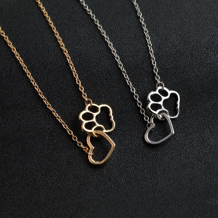 Sentimental women's paw print heart necklace, ideal gift for dog moms, cat moms, & pet enthusiasts.
