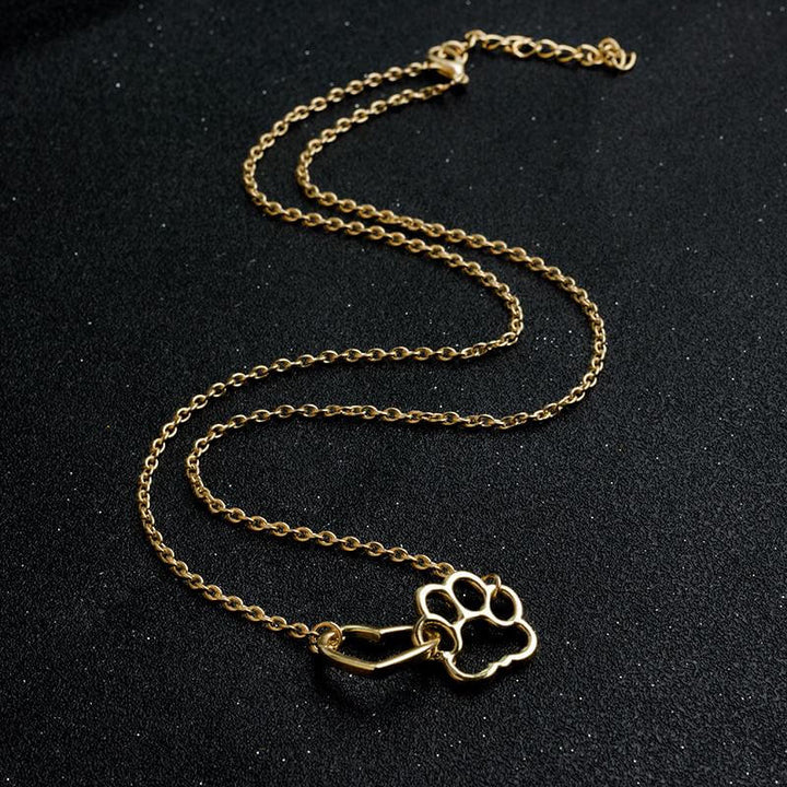 Stylish silver heart pendant with paw print, a thoughtful pet necklace for animal lovers.