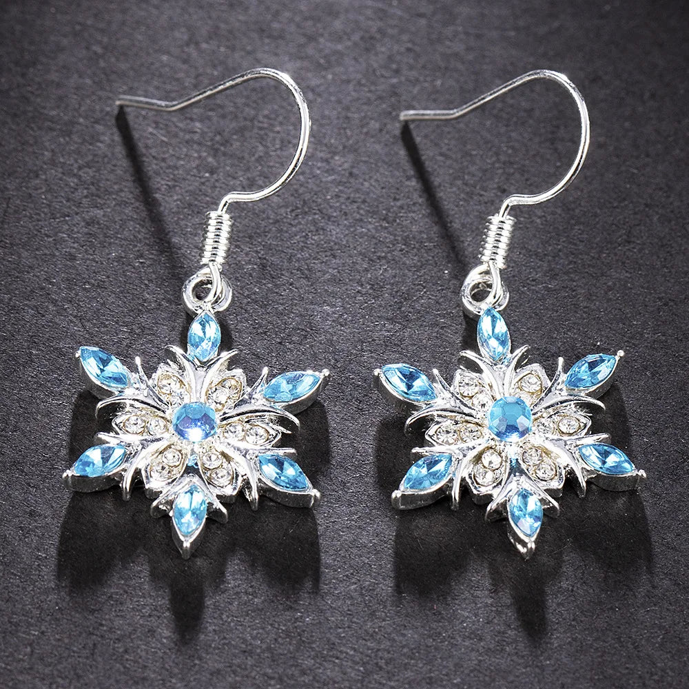 Delicate silver snowflake earrings, festive women's jewelry for Christmas and winter.