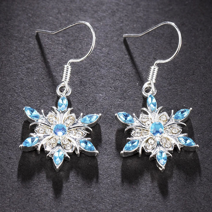 Delicate silver snowflake earrings, festive women's jewelry for Christmas and winter.