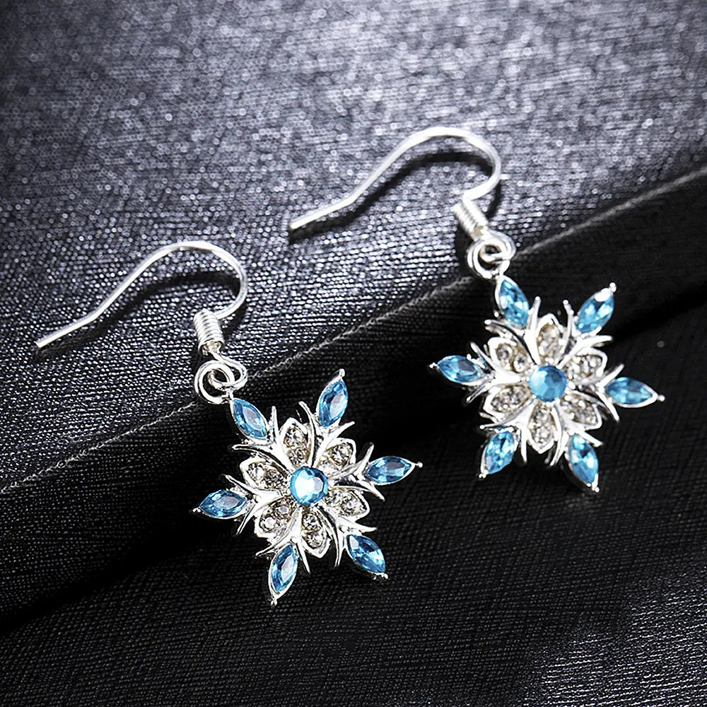 Beautiful silver snowflake dangle earrings, ideal women's festive Christmas accessory.