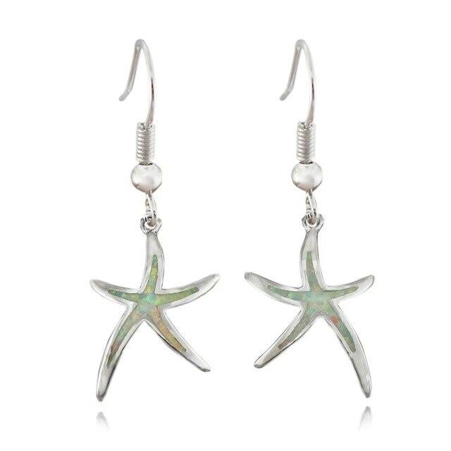 Elegant women's silver starfish earrings, featuring a sparkling opal gemstone, perfect marine life gift.
