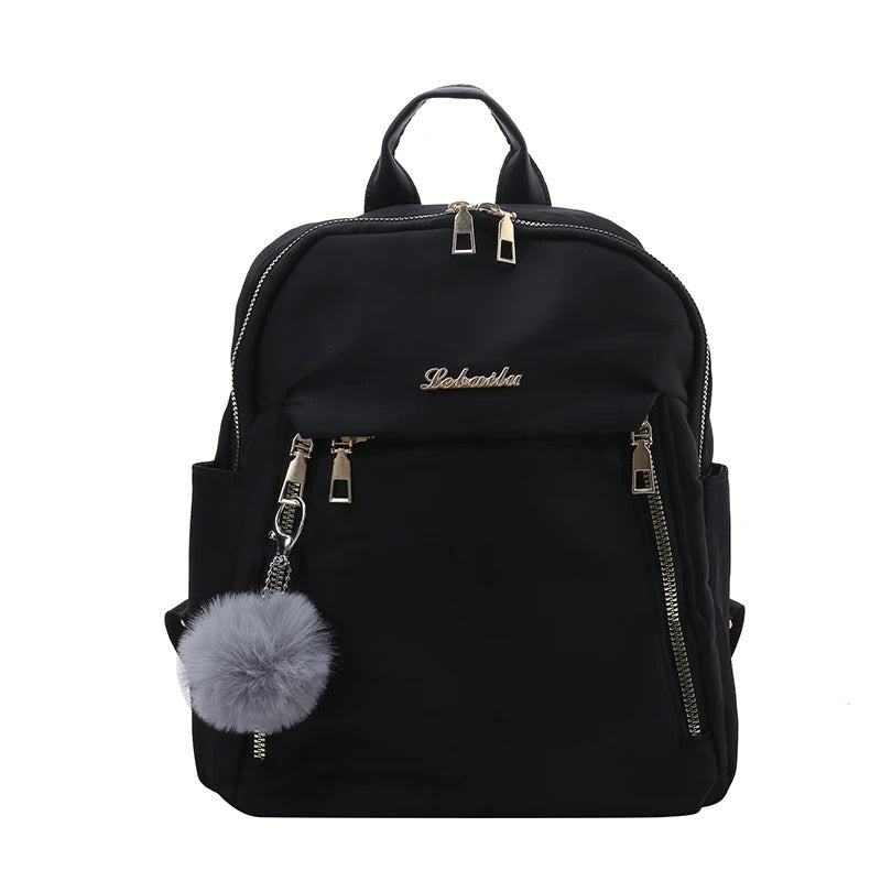 Stylish women's travel backpack in black PU leather, perfect for carrying essentials.