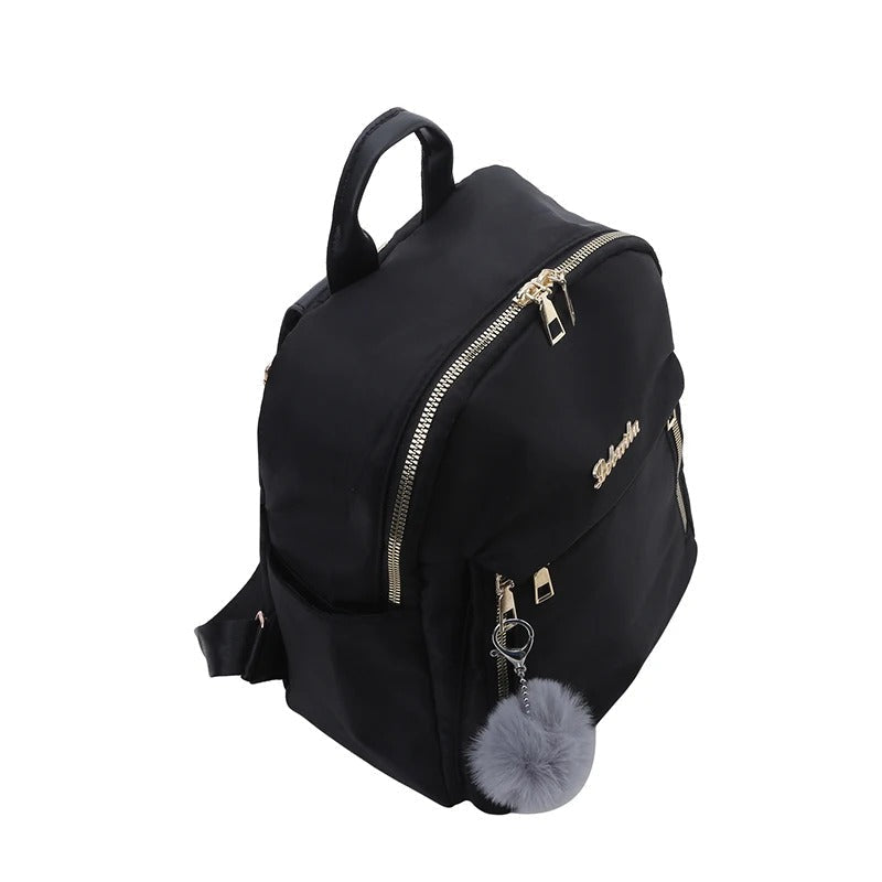Woman wearing a black PU leather travel backpack, showcasing its fashion accessory appeal.