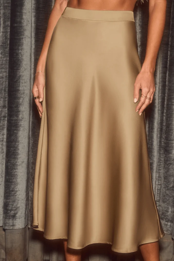 Women's sleek flowy A-line midi skirt, perfect for elegant office wear or casual outings. High-rise fit.