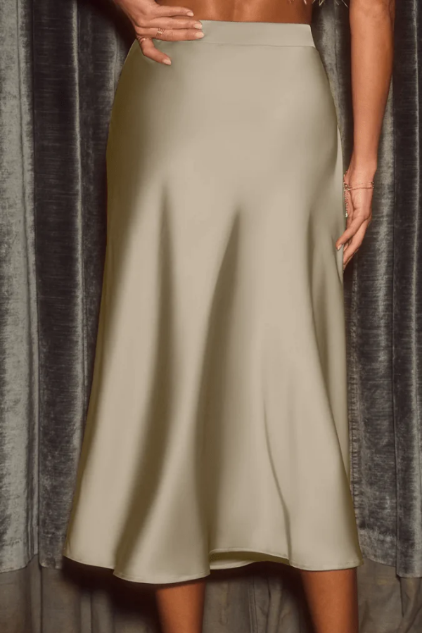 Comfortable & stylish women's flowy midi skirt. High-rise A-line cut for elegant, versatile wear.