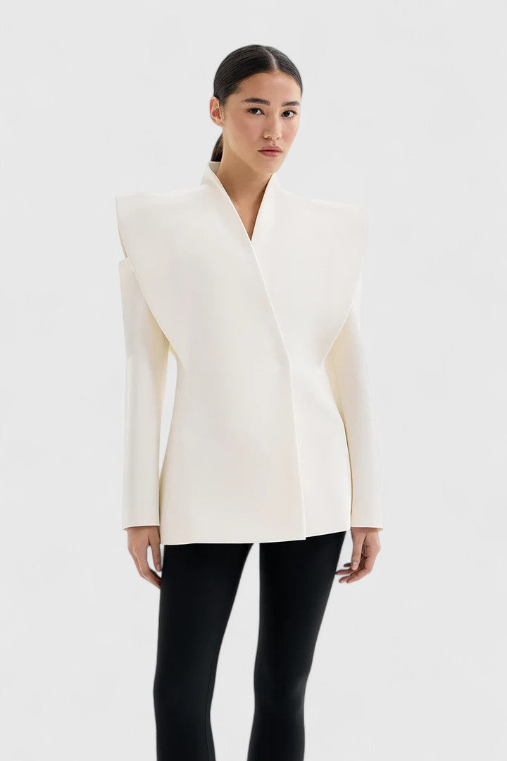 Women's sleek ivory tailored blazer with structured shoulders, perfect for modern workwear and sophisticated style.