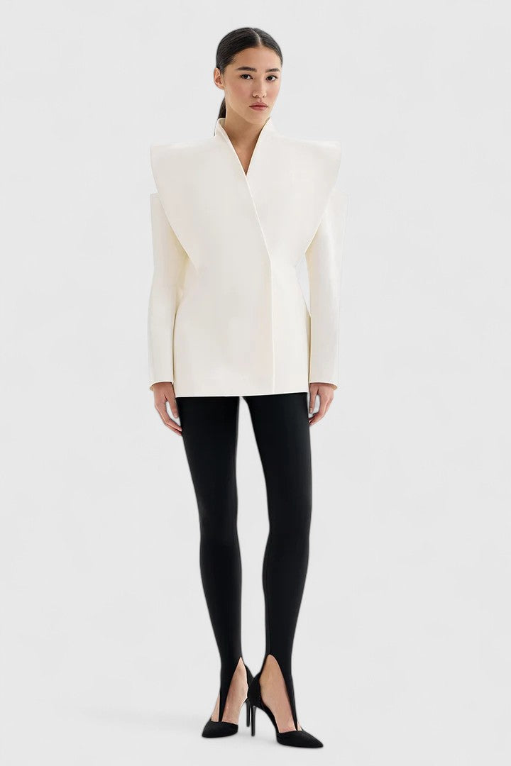 Chic women's ivory tailored blazer. Features sleek design & structured shoulders, perfect for a modern, elegant look.