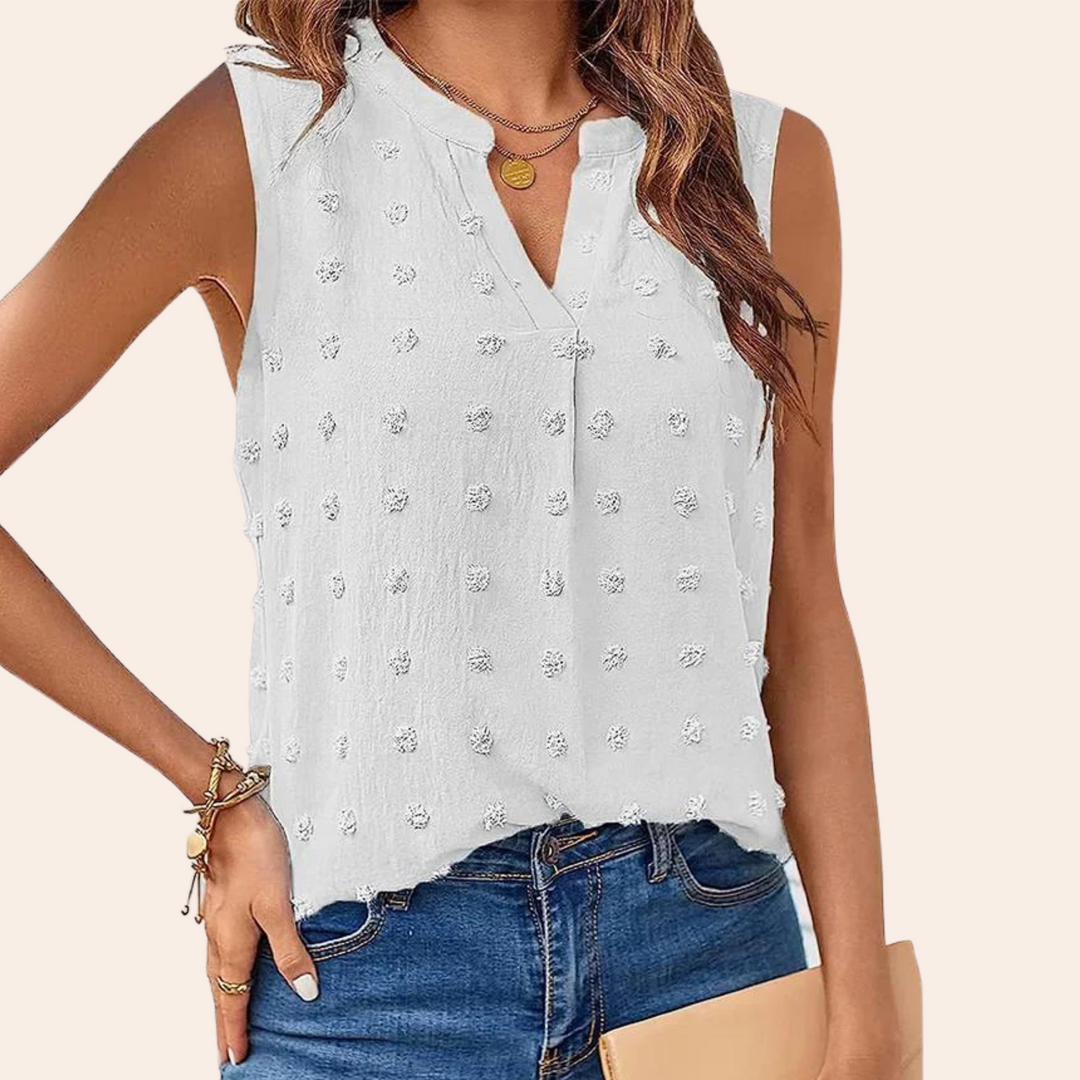 Lightweight women's sleeveless blouse, ideal for summer, shown in a vibrant coral color