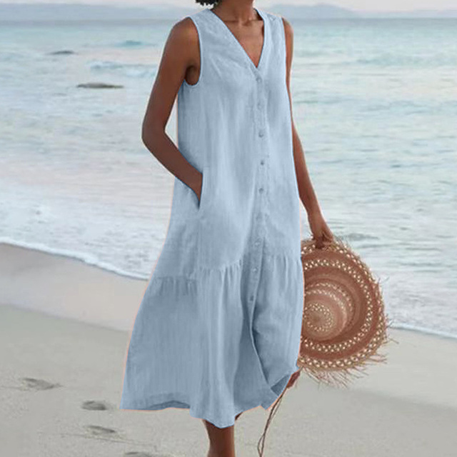 Relaxed fit women's sleeveless midi dress featuring full button front. A comfy everyday or vacation dress.