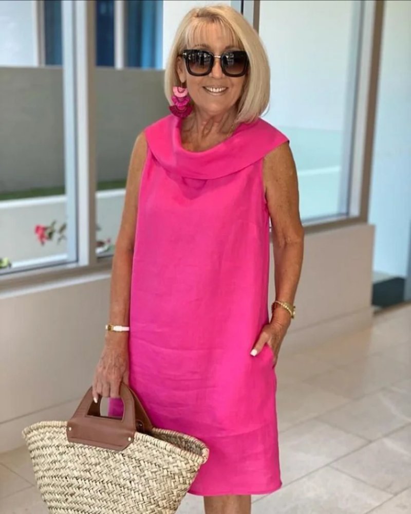 Women's sleeveless cowl neck shift dress with pockets. Perfect knee-length casual summer dress for comfort.