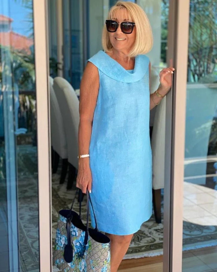 Relaxed fit women's shift dress with cowl neck & pockets. Ideal for spring, summer, and vacation daily wear.