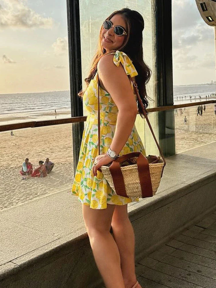 Stylish women's lemon print summer dress. Sleeveless, breezy, and perfect for vacation, beach, or casual party wear.