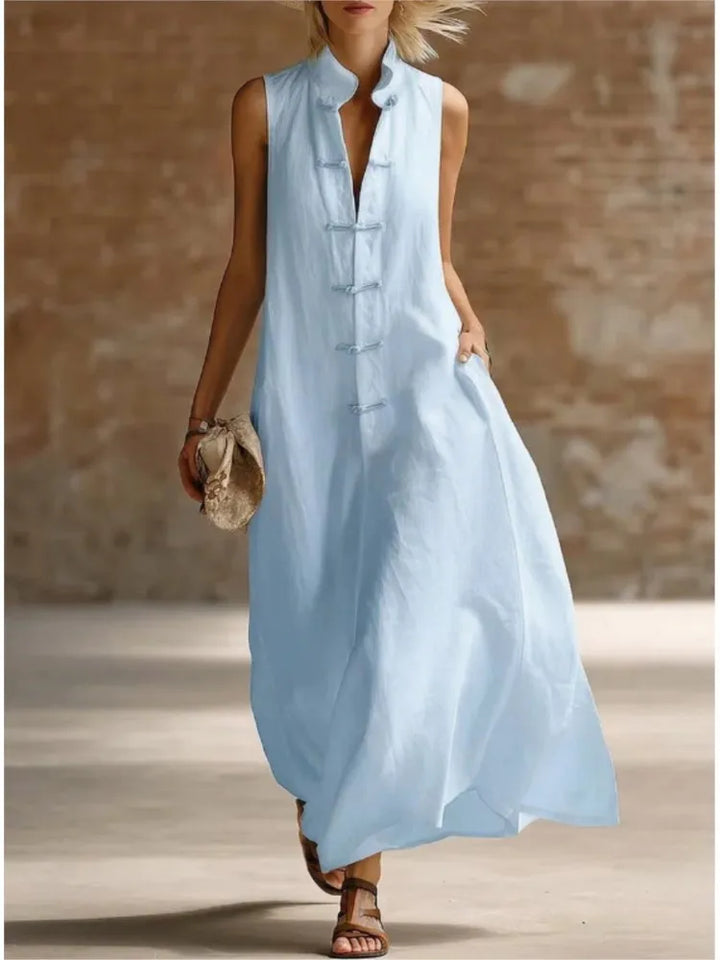 Women's sleeveless maxi shirt dress with collared neckline and button front detail. Perfect for summer fashion.